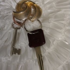 .Crown Motif Design key chain $28 one size + Free scarf or hat.
